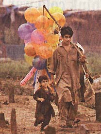 afghan boy selling balloons